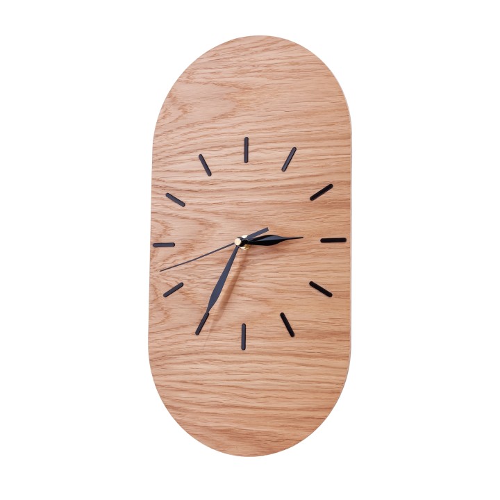 Oval clock made of oak plywood