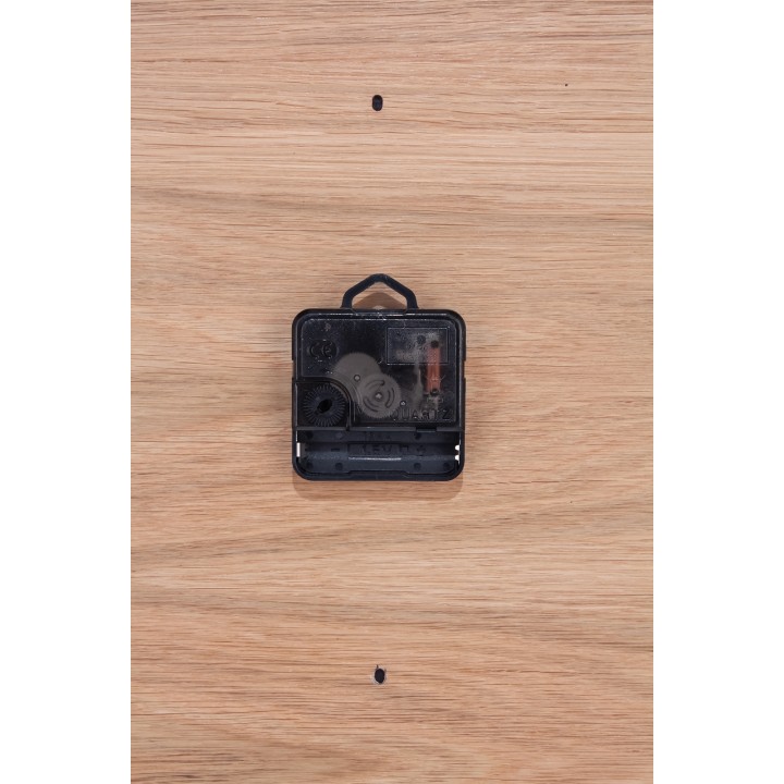 Oval clock made of oak plywood